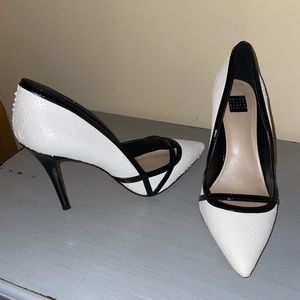 White heels with black detailing